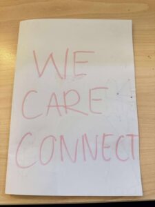 The front of a hand drawn booklet with the text "We Care Connect"